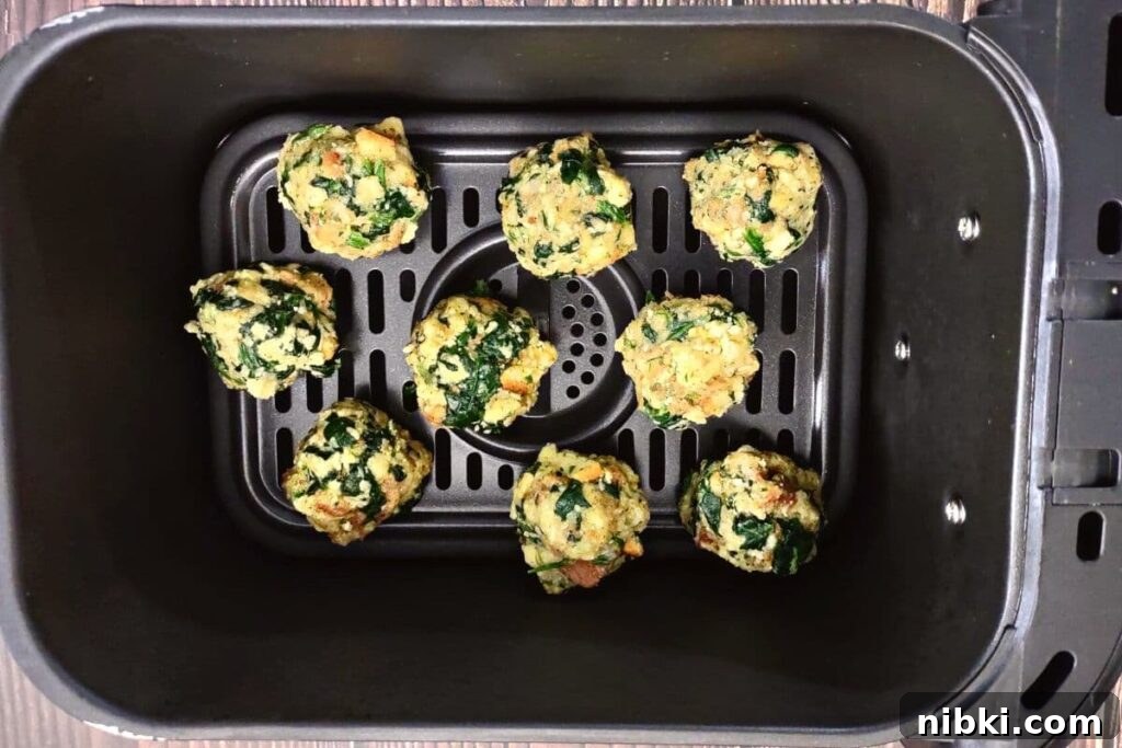 Air Fryer Spinach Balls: Crispy Appetizer Recipe 8 place uncooked spinach balls in air fryer basket
