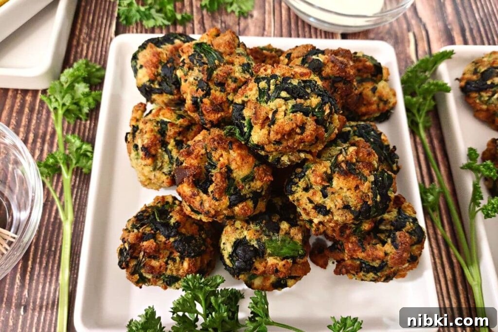 Air Fryer Spinach Balls: Crispy Appetizer Recipe 10 homemade spinach balls made in the air fryer on a square plate
