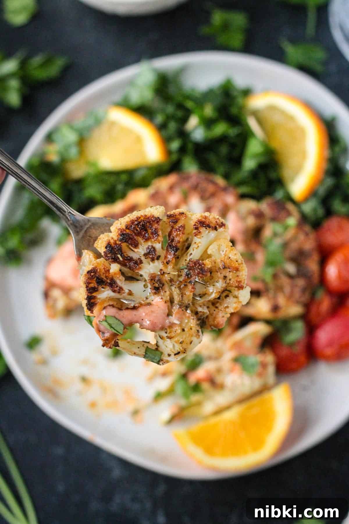How to Make Crispy Vegan Roasted Cauliflower Steaks 7 Bite of roasted cauliflower on a fork.
