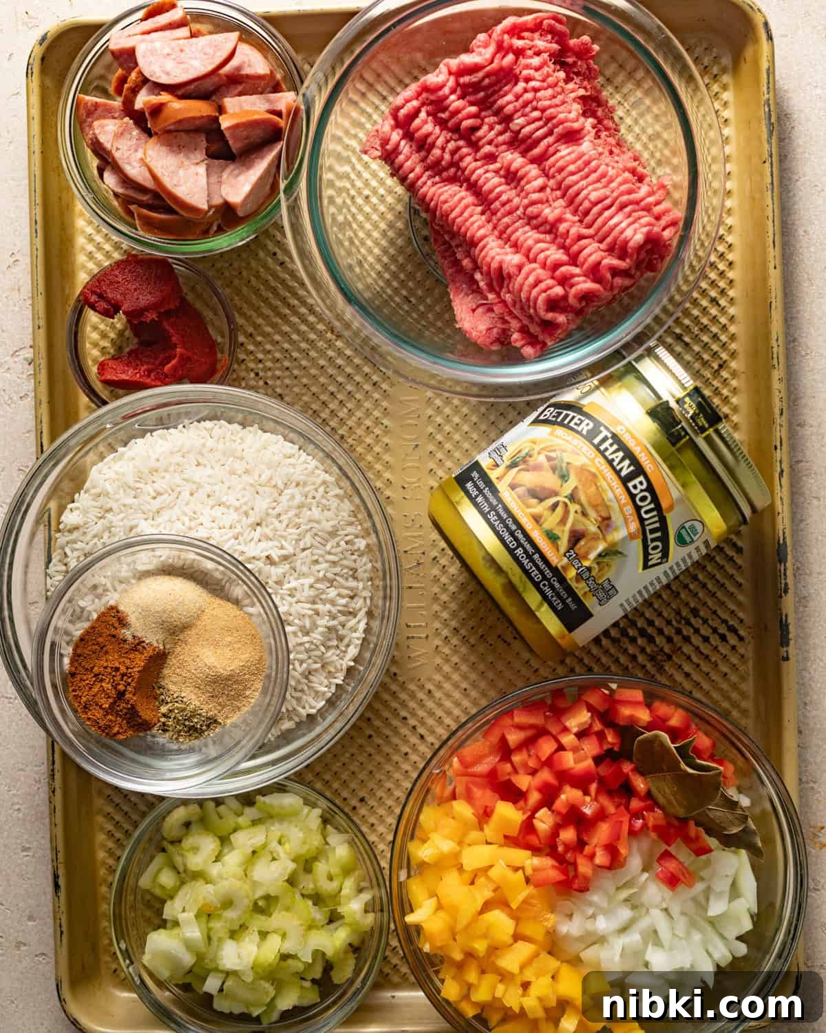 Authentic Louisiana Dirty Rice Recipe 2 ingredients to make dirty rice - ground beef, andouille sausage, rice, bell pepper, onion, celery, chicken bouillon, seasonings, chicken broth, and worcestershire sauce.