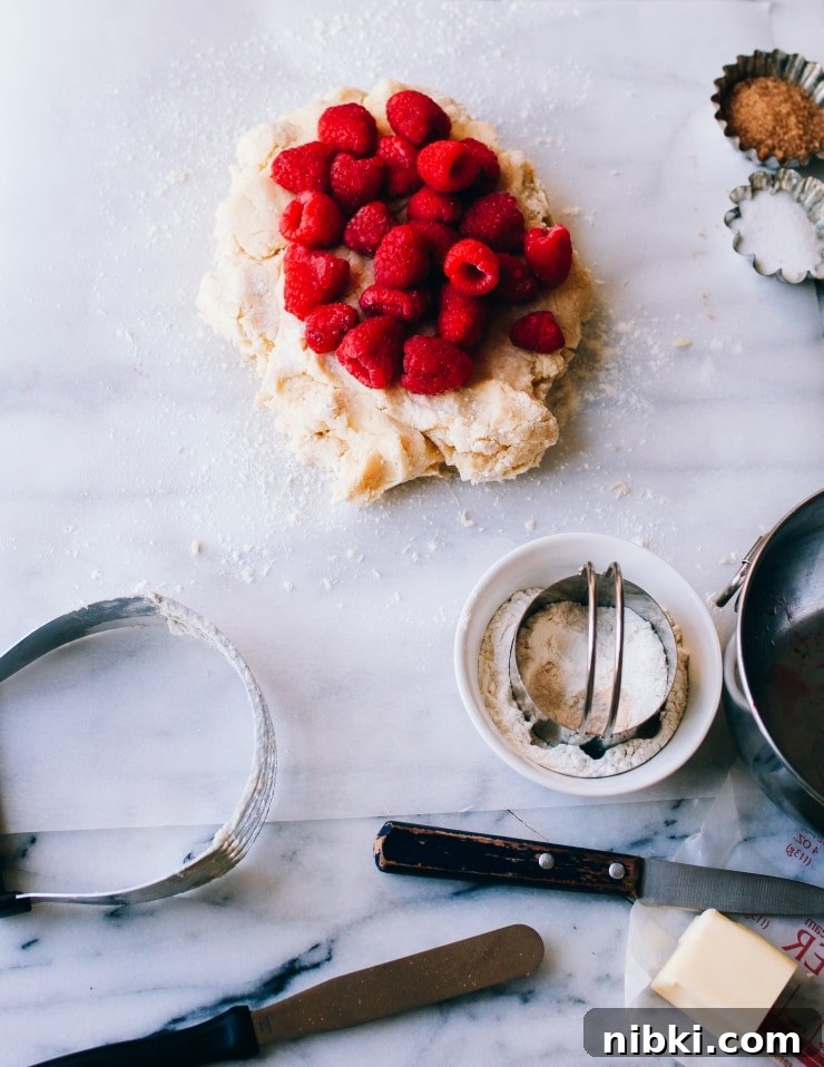 Flaky Homemade Raspberry Scones with Lemon Glaze 8 Raspberry scone recipe dough | sophisticatedgourmet.com