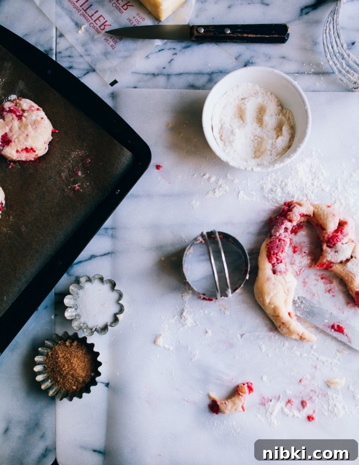 Flaky Homemade Raspberry Scones with Lemon Glaze 9 Cutting out raspberry scone dough