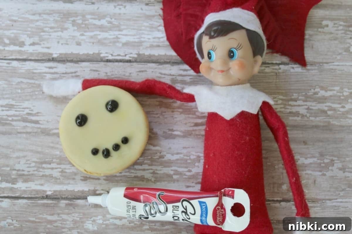 Elf on the Shelf Snowman Moon Pie Recipe 2 Elf on the Shelf making a Snowman Moon Pie - simple holiday snack idea