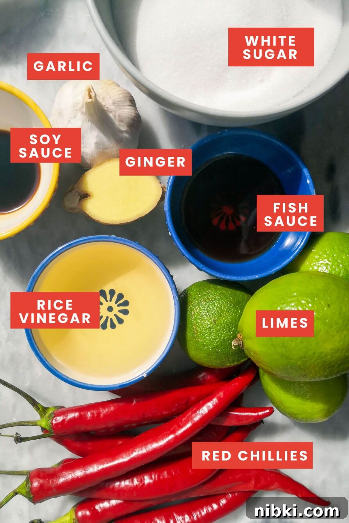 30-Minute Sweet Chili Jam Recipe 2 Ingredients for easy chilli jam laid out on a grey marble background, labelled.
