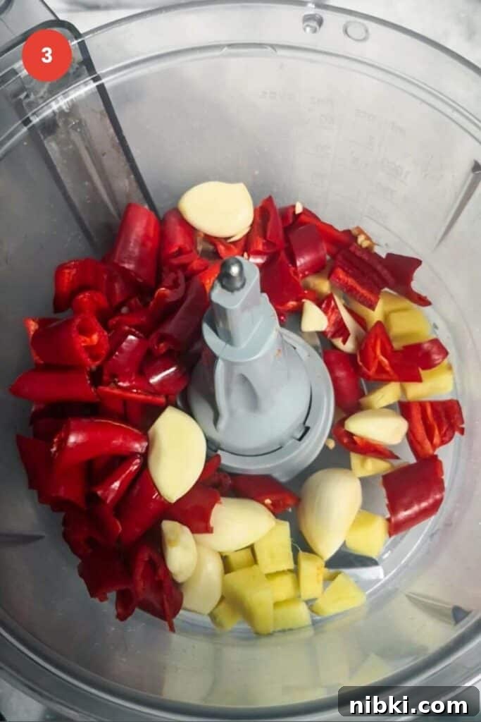 30-Minute Sweet Chili Jam Recipe 5 Chilies, ginger and garlic in a food processor.