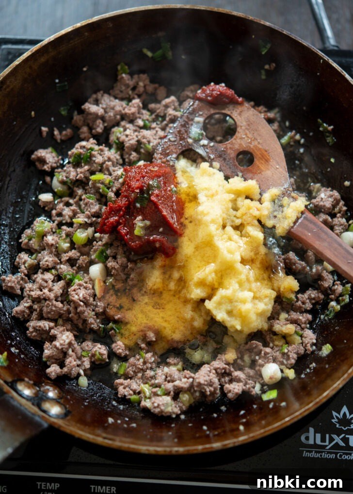 20-Minute Beef Noodles with Gochujang Sauce 9 Gochujang and honey are added to ground beef mixture in a skillet