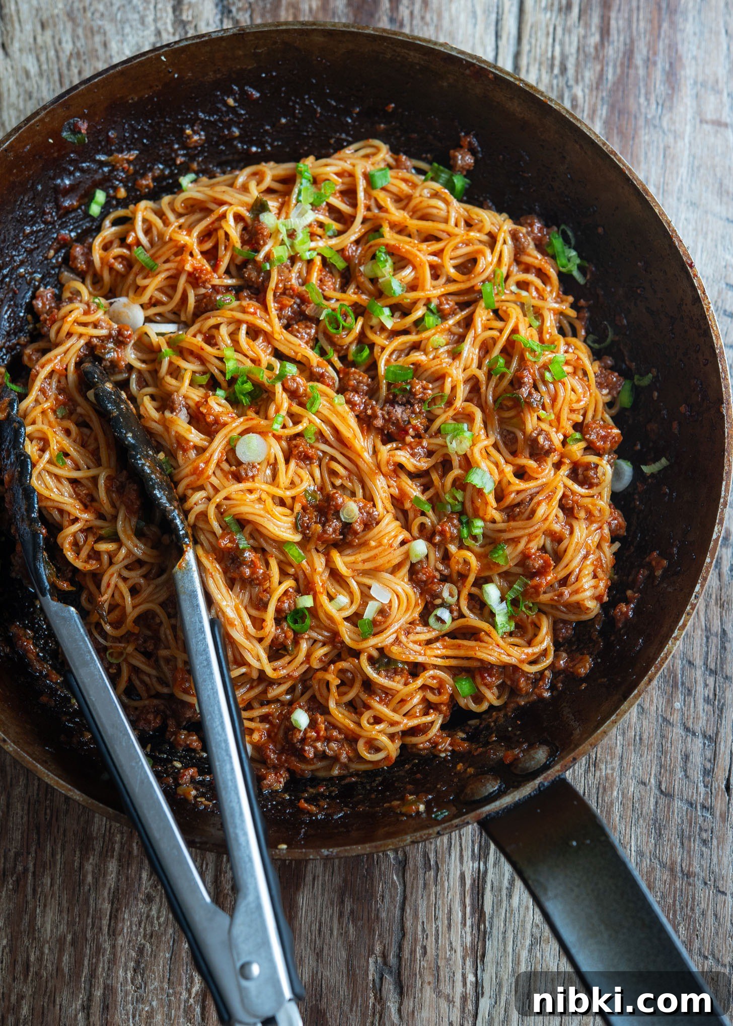 20-Minute Beef Noodles with Gochujang Sauce 12 A skillet filled with beef gochujang noodles