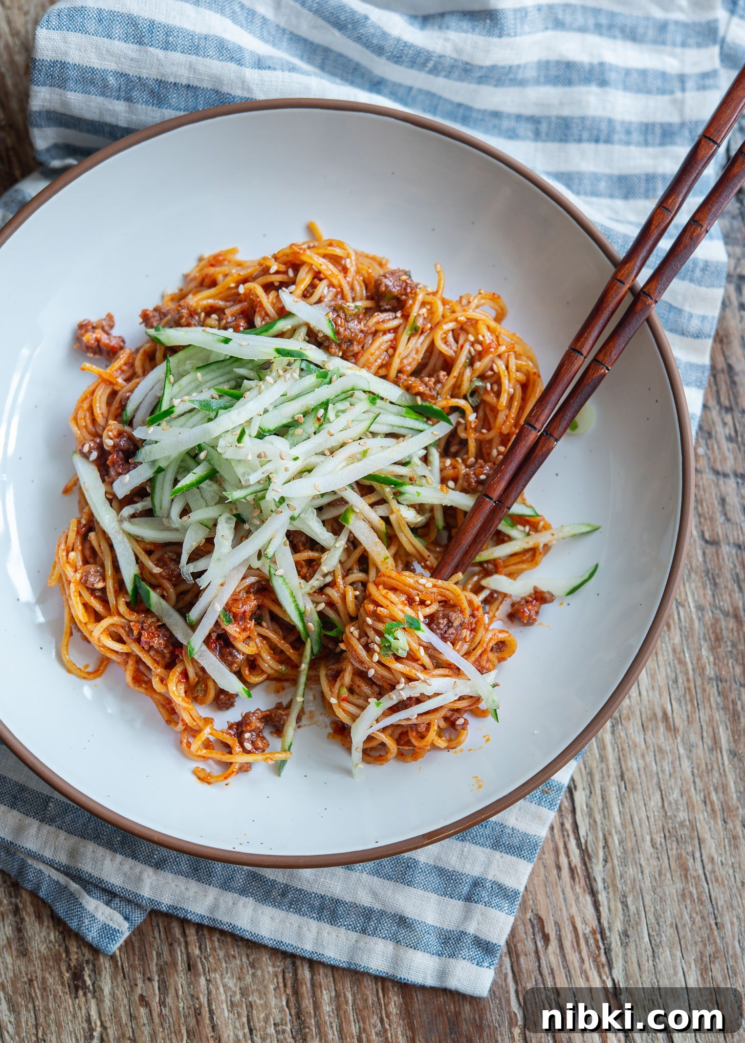 20-Minute Beef Noodles with Gochujang Sauce 2 Korean gochujang noodles with beef and cucumber served in a bowl