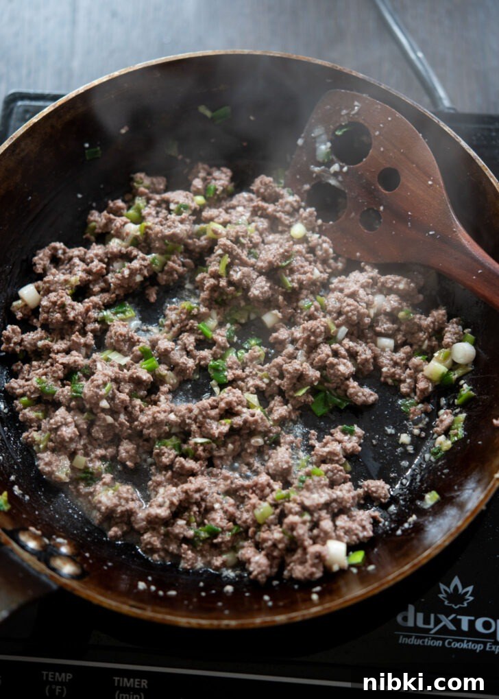 20-Minute Beef Noodles with Gochujang Sauce 7 Ground beef browned in a skillet to make Korean gochujang noodles with beef.