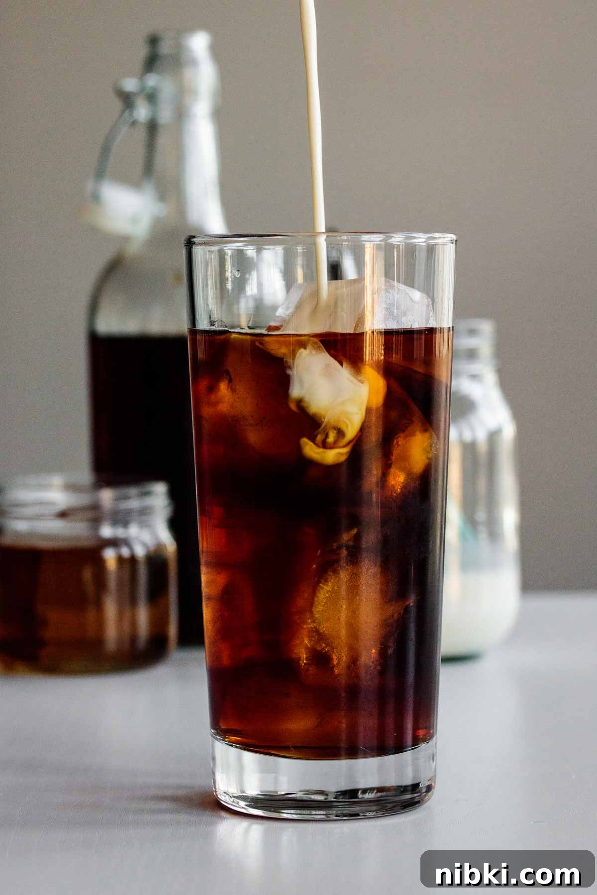 How to Make Starbucks Vanilla Sweet Cream Cold Brew at Home 4 vanilla sweet cream being poured into cold brew glass