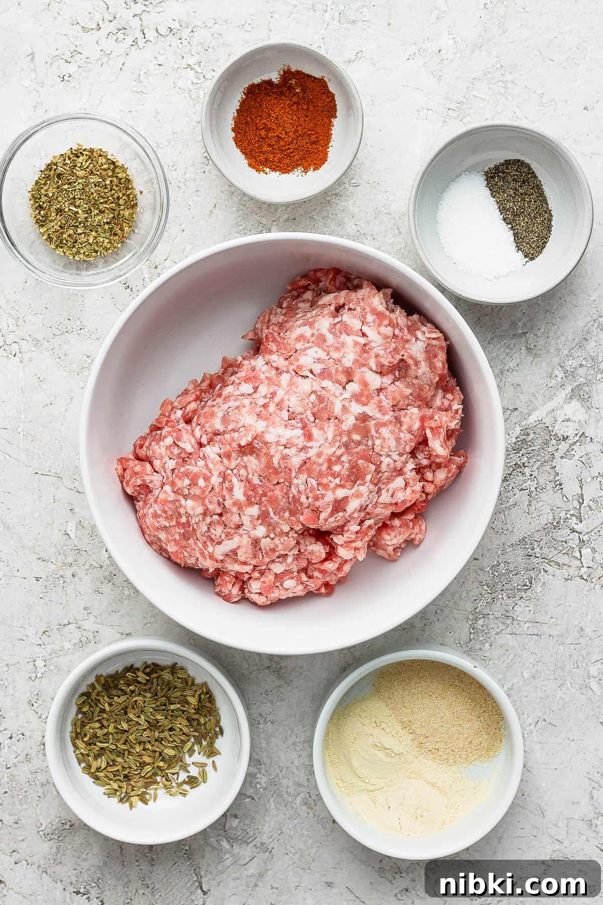 Ingredients for healthy breakfast sausage in separate bowls.