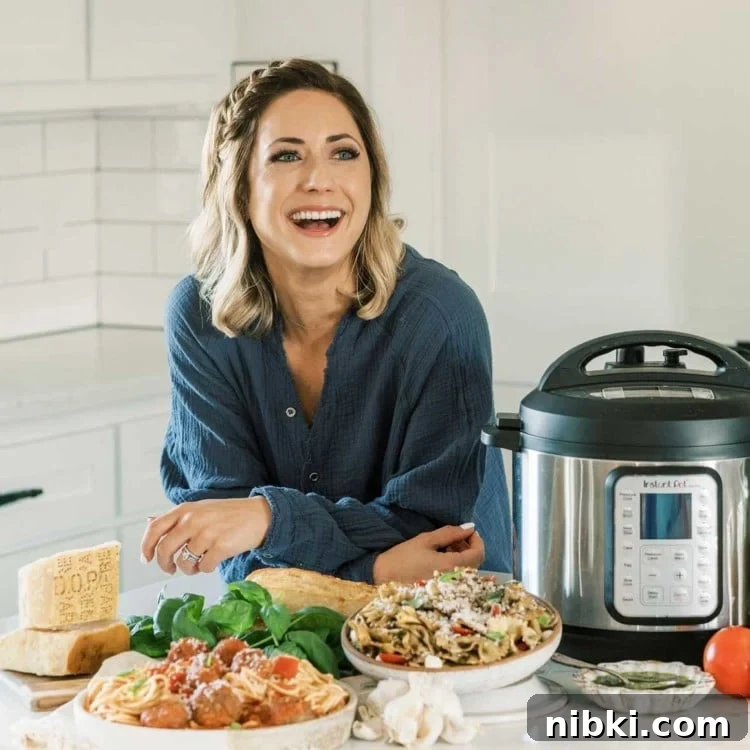 Blogger in a kitchen with an Instant Pot and several dishes of food