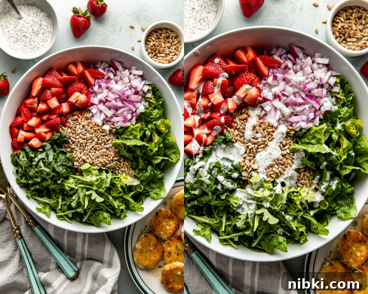 Large salad bowl with chopped strawberries, onion, sunflower seeds, romaine, and arugula before tossing.