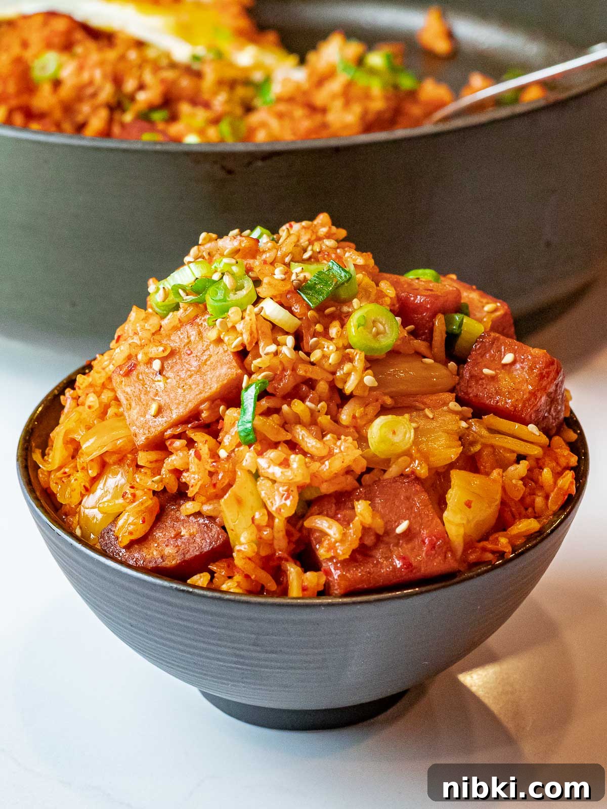 Spicy Kimchi Fried Rice with Crispy Spam 7 bowl of kimchi spam fried rice with scallions