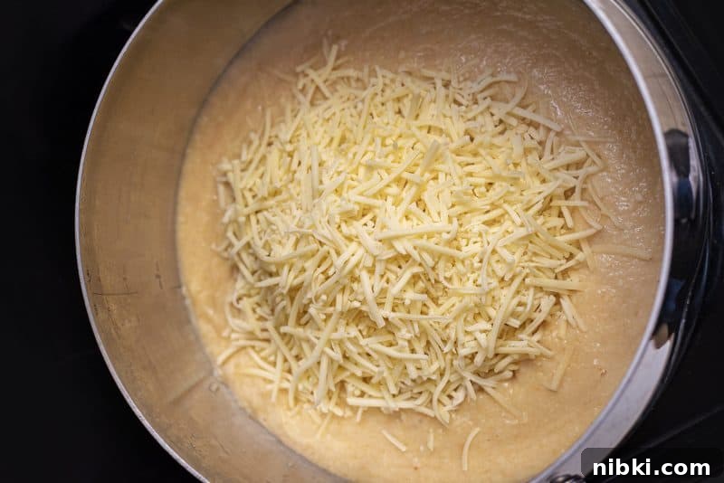 Creamy Cauliflower Soup with Melted Cheese 6 Return soup to pot and add cheese.