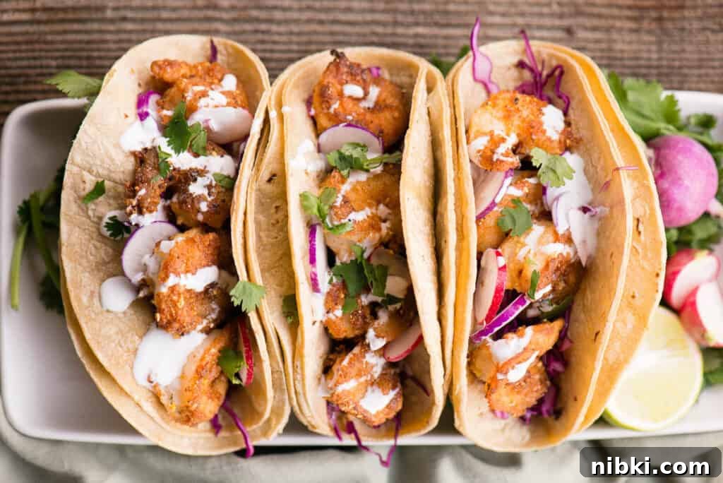 Crispy Baja Shrimp Tacos with Lime Crema 12 Crispy Shrimp Tacos on platter