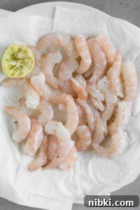 Crispy Baja Shrimp Tacos with Lime Crema 13 raw shrimp on paper towel lined plate