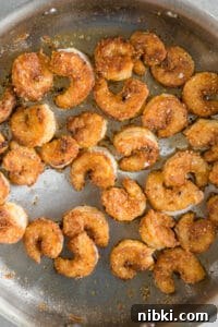 Crispy Baja Shrimp Tacos with Lime Crema 15 cooked fried breaded shrimp in pan