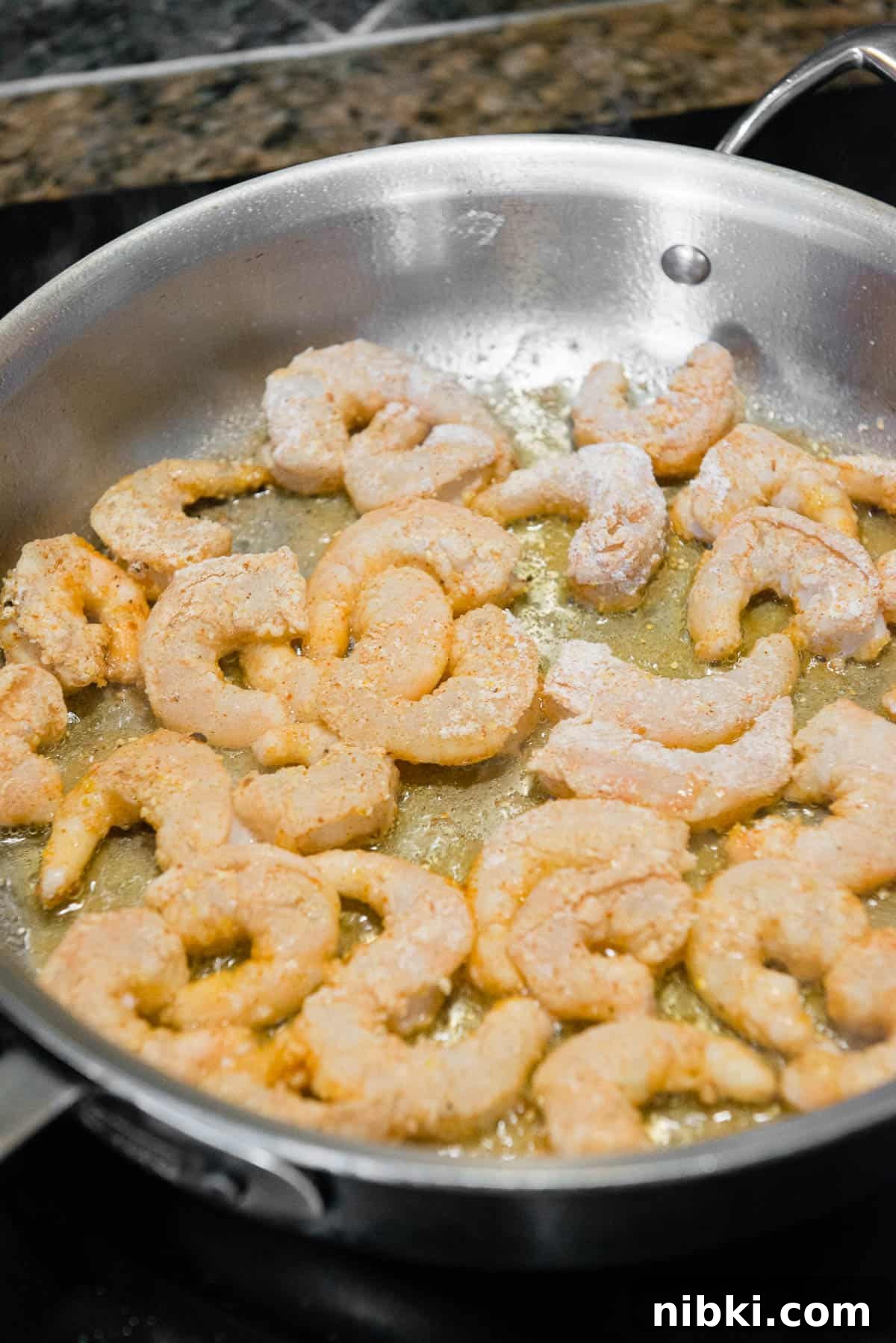 Crispy Baja Shrimp Tacos with Lime Crema 7 Cooking shrimp in pan