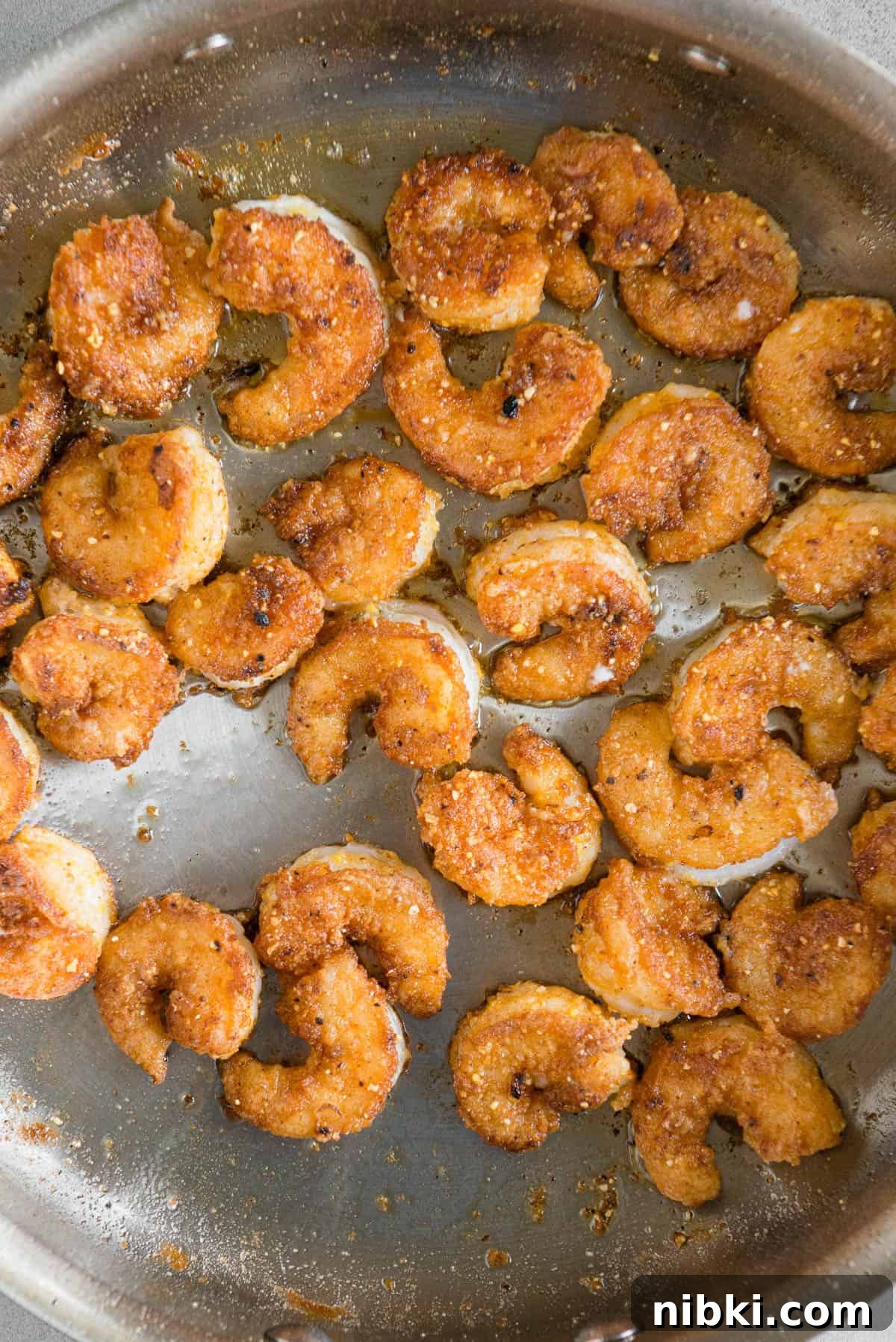 Crispy Baja Shrimp Tacos with Lime Crema 9 cooked fried breaded shrimp in pan