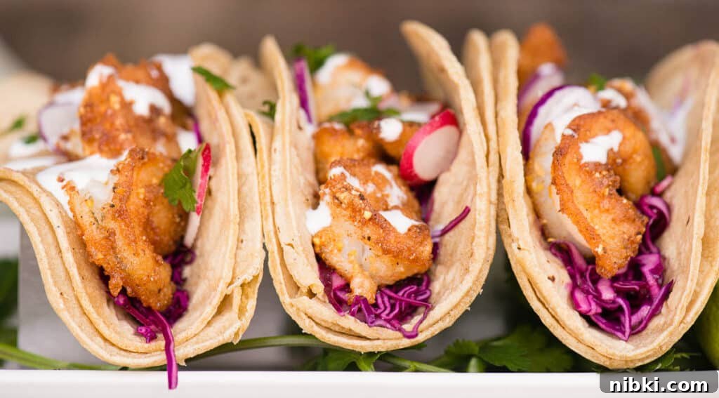 Crispy Baja Shrimp Tacos with Lime Crema 10 Shrimp Tacos with coleslaw and crema