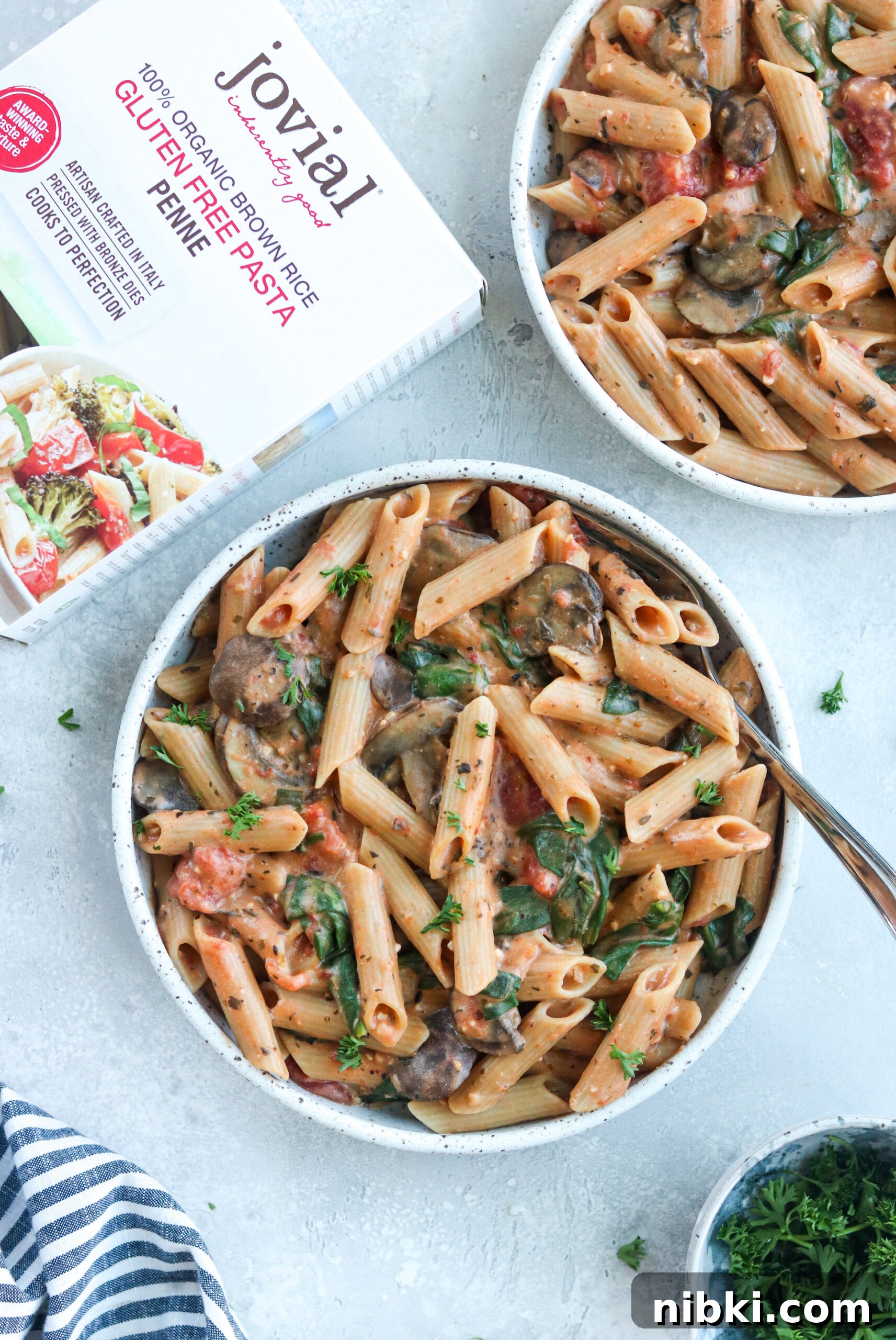 Instant Pot Creamy Tomato Penne Instant Pot Creamy Tomato Penne on a white bowl and a recipe book