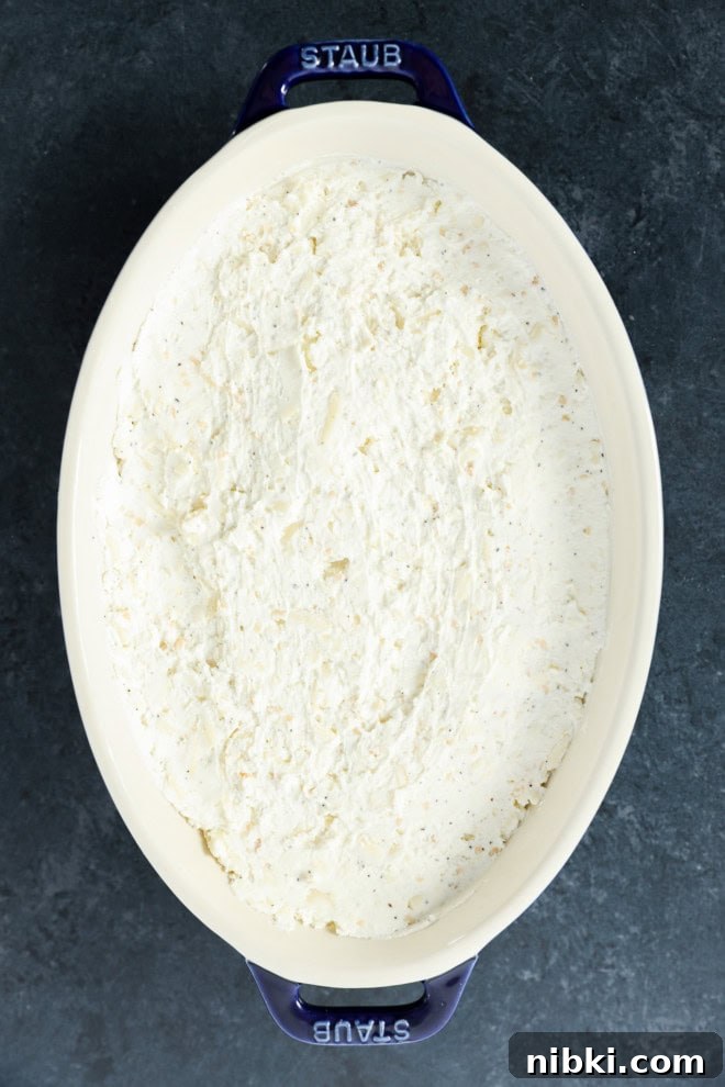 baked goat cheese appetizer in baking dish before baking