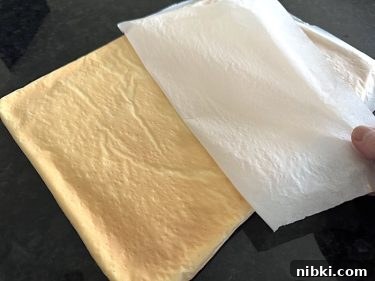 Peel away paper – keep it flat as you pull