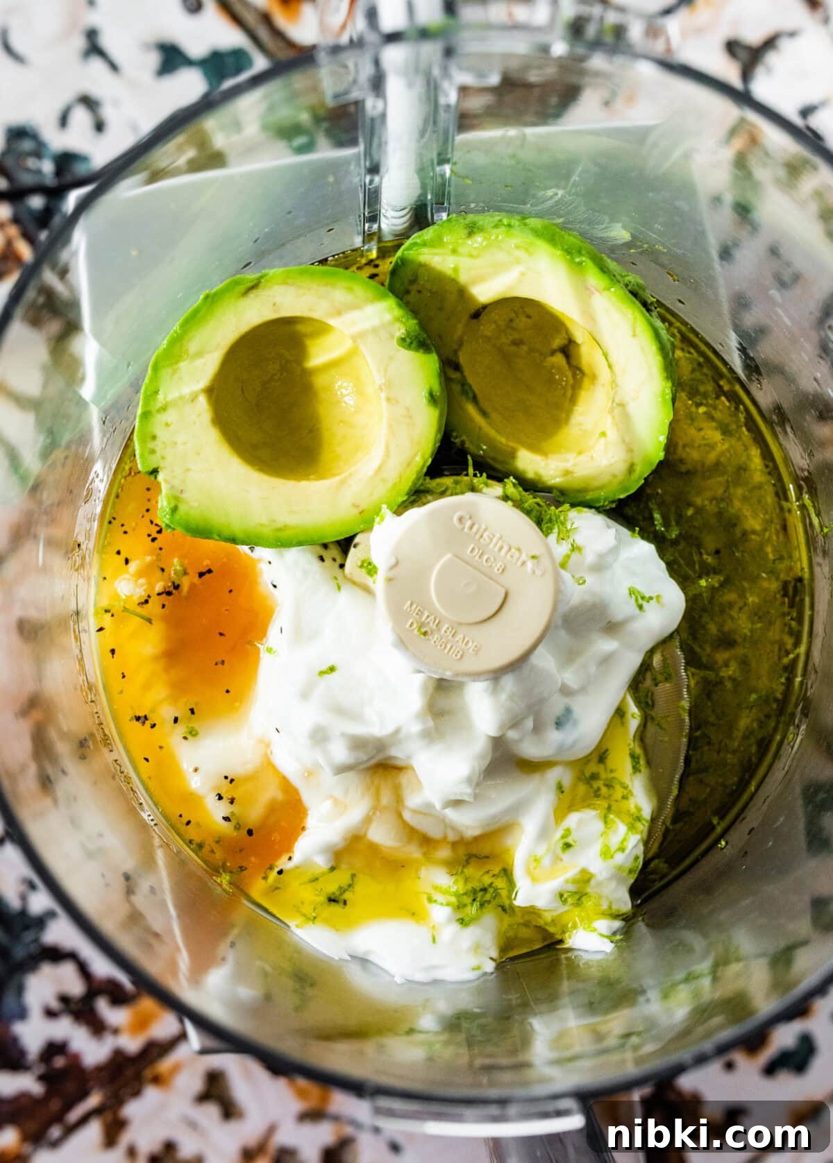 Creamy Avocado Coleslaw Recipe for Summer BBQs 4 all the wet ingredients for the creamy avocado coleslaw in a food processor.
