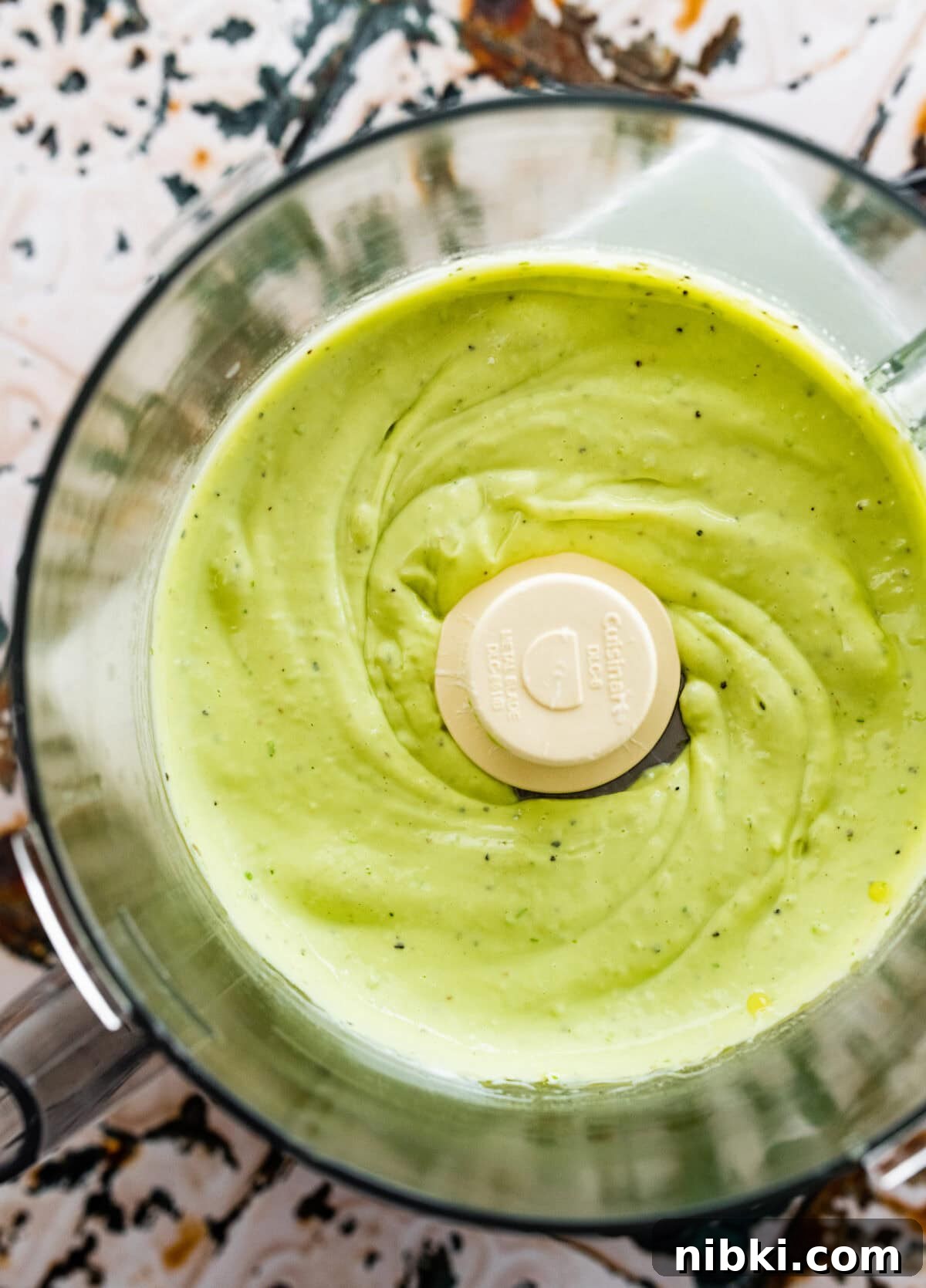 Creamy Avocado Coleslaw Recipe for Summer BBQs 5 blended creamy avocado dressing in the food processor.
