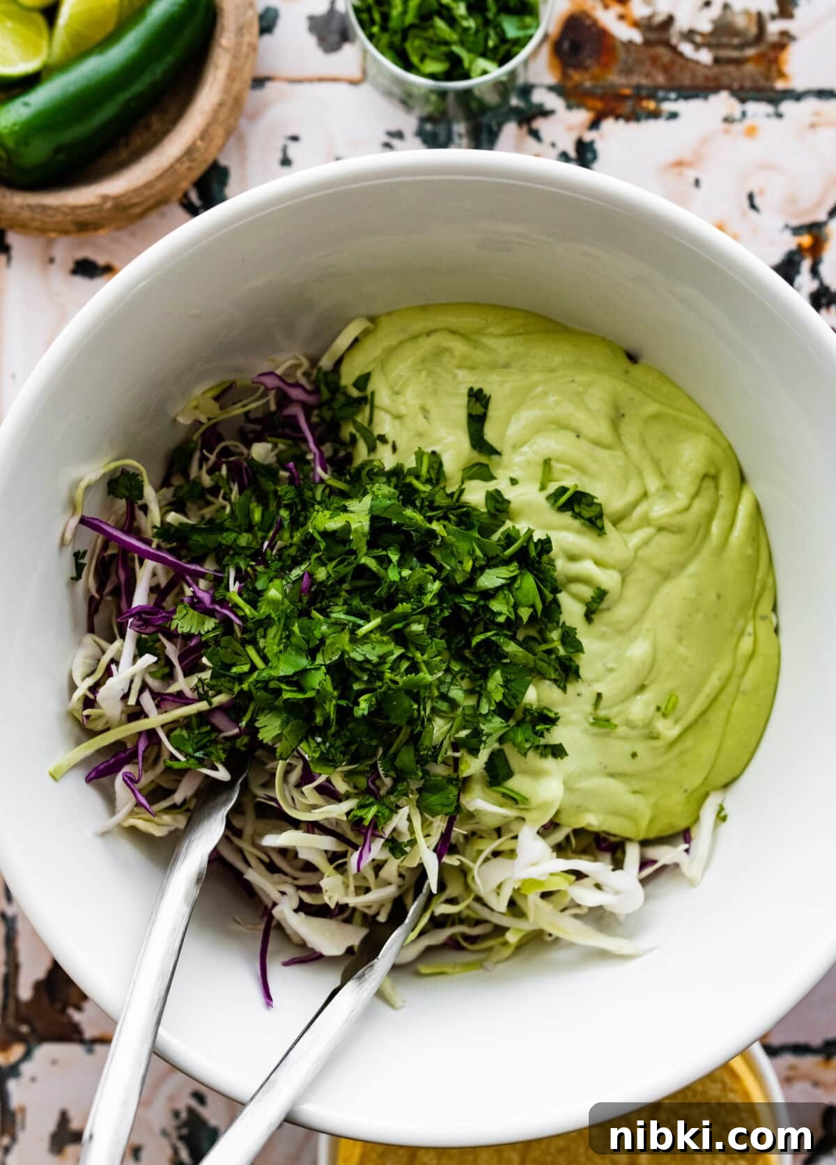 Creamy Avocado Coleslaw Recipe for Summer BBQs 7 add all the salad ingredients to a large bowl and mix to combine.