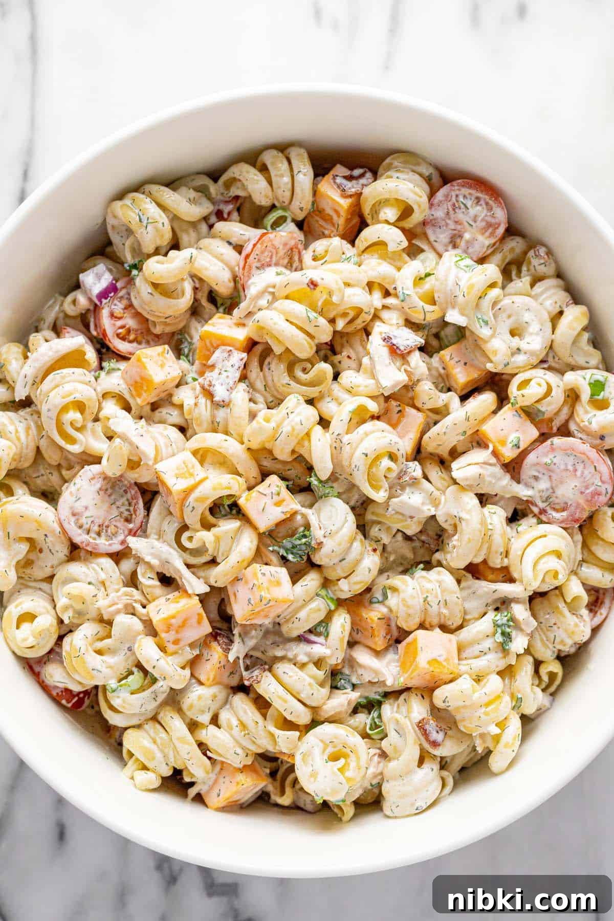 Creamy Chicken Bacon Ranch Pasta Salad Recipe 6 Freshly tossed chicken ranch pasta salad in a large bowl.