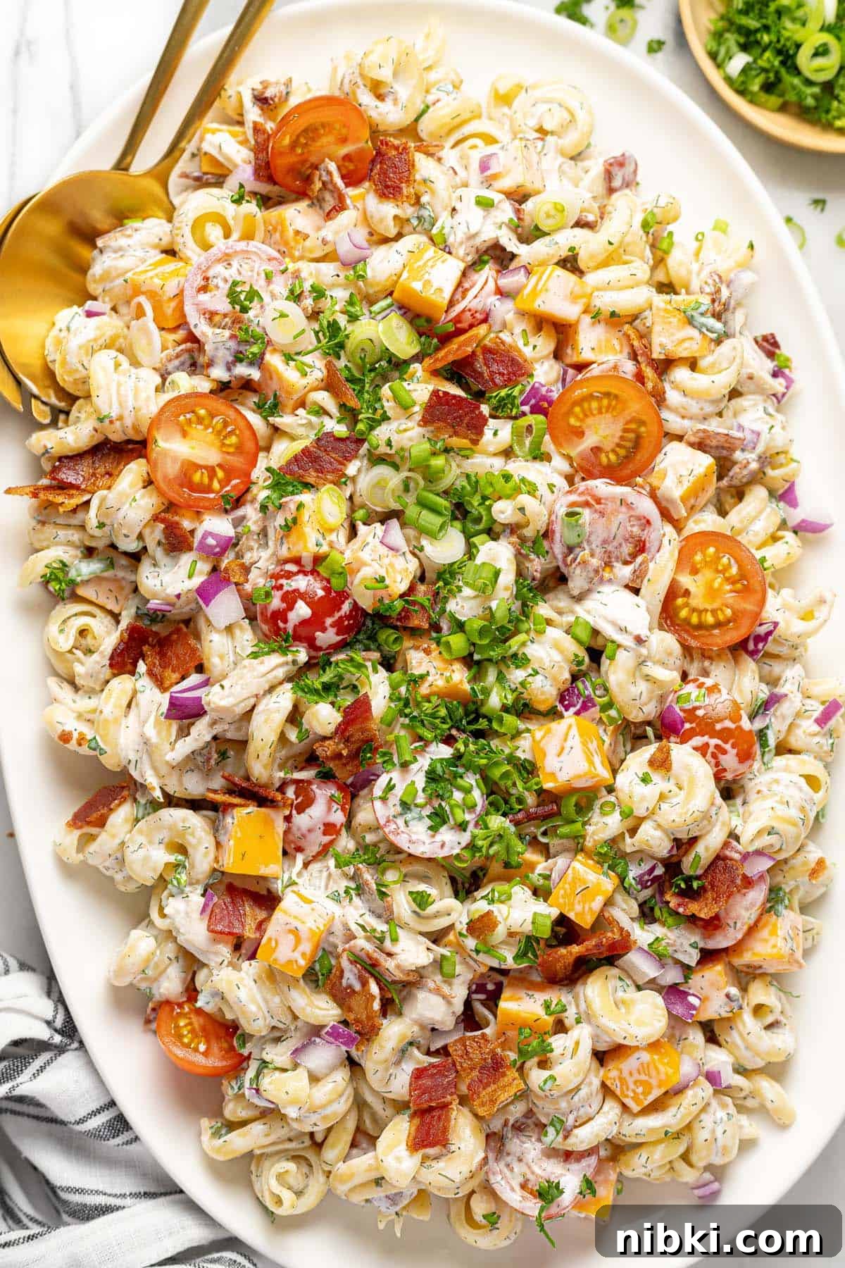 Creamy Chicken Bacon Ranch Pasta Salad Recipe 7 Large oval platter filled with homemade chicken bacon ranch pasta salad.