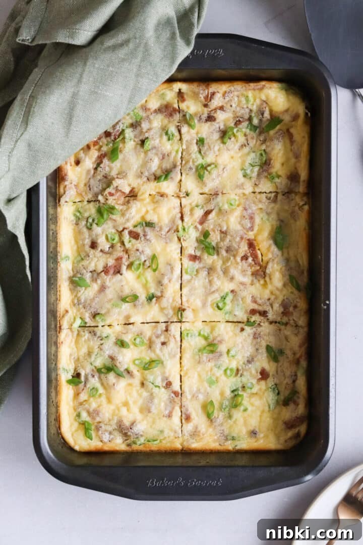 Savory Cottage Cheese Frittata Recipe 2 Cottage cheese egg bake frittata sliced in a large baking pan and topped with green onions