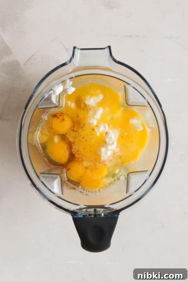 Savory Cottage Cheese Frittata Recipe 4 Ingredients for cottage cheese egg bake in a large blender, unmixed