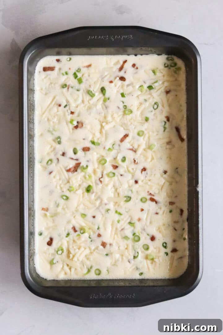 Savory Cottage Cheese Frittata Recipe 6 Raw cottage cheese egg bake topped with shredded cheese, sliced green onions, and cooked and chopped turkey bacon