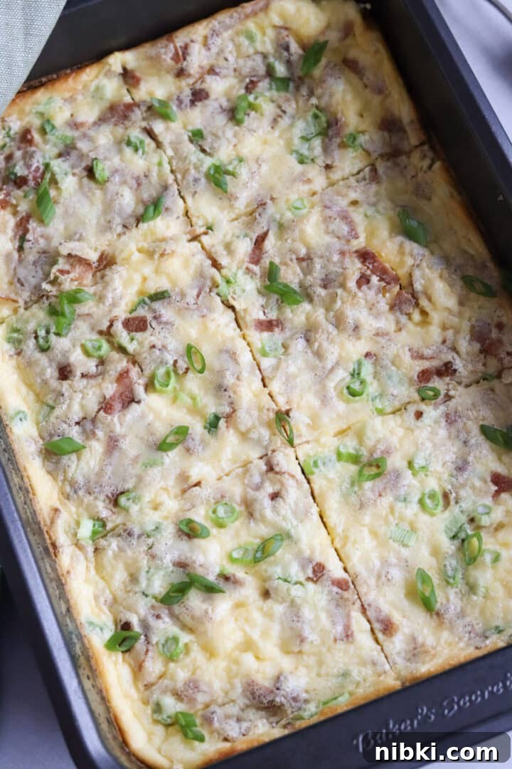 Savory Cottage Cheese Frittata Recipe 7 Cottage cheese egg bake with green onions, bacon and cheese sliced in a large non-stick metal pan
