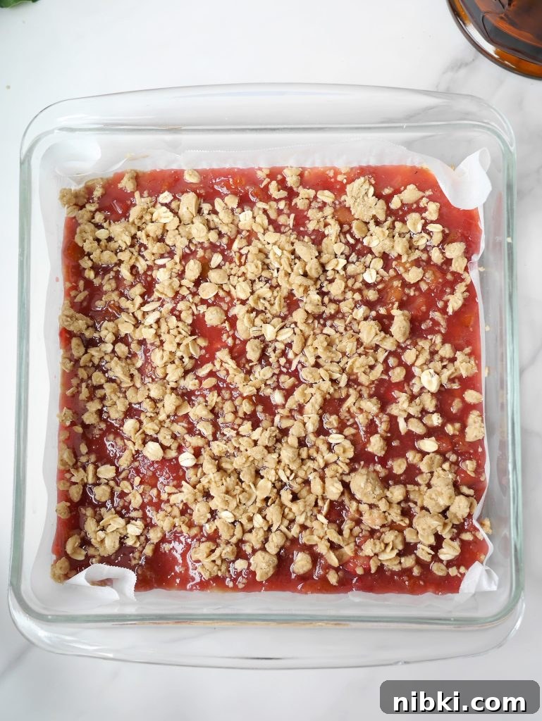 Amish Oatmeal Rhubarb Crumb Bars Recipe 7 Pouring rhubarb filling over base