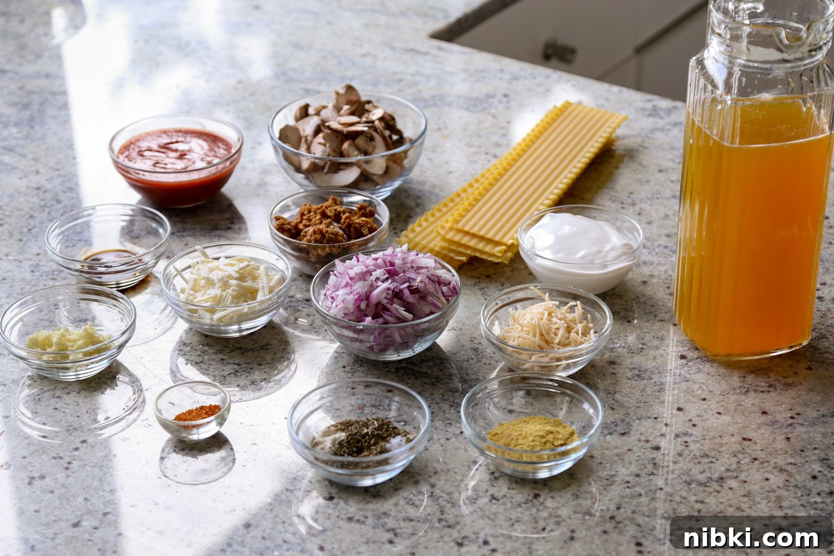 30-Minute One-Pan Creamy Lasagna Soup 7 lasagna soup ingredients in bowls on a kitchen counter