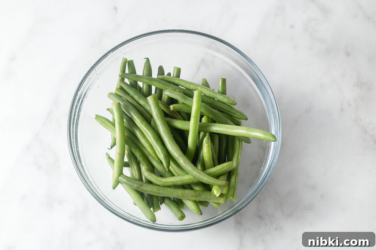 rinsed and trimmed green beans in a bowl.