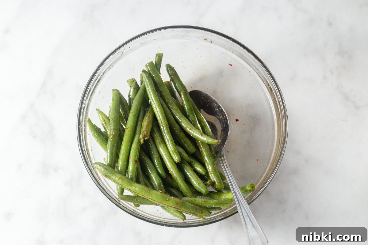 marinated air fryer green beans in a bowl.