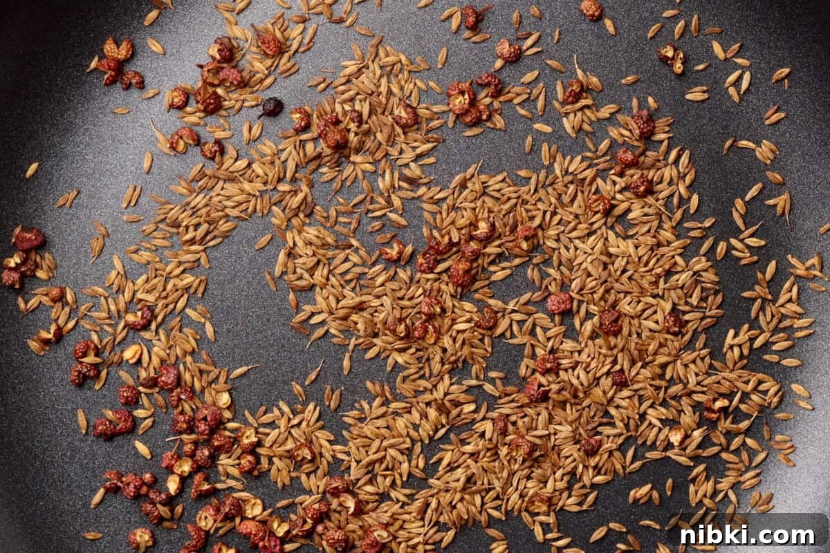 Cumin-Spiced Lamb Recipe: Tender, Flavorful Roast 4 Cumin seeds and dried red Sichuan peppercorns in a pan