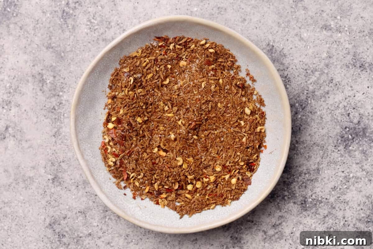 Cumin-Spiced Lamb Recipe: Tender, Flavorful Roast 5 A plate filled with spice blend