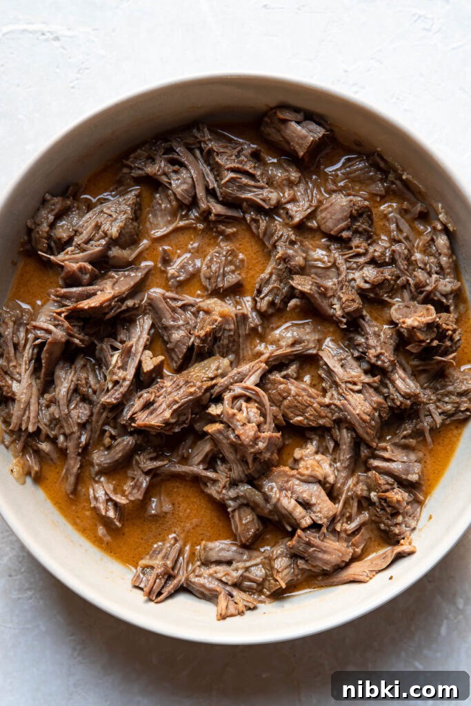 Instant Pot Barbacoa Tacos 7 instant pot beef barbacoa in a bowl.