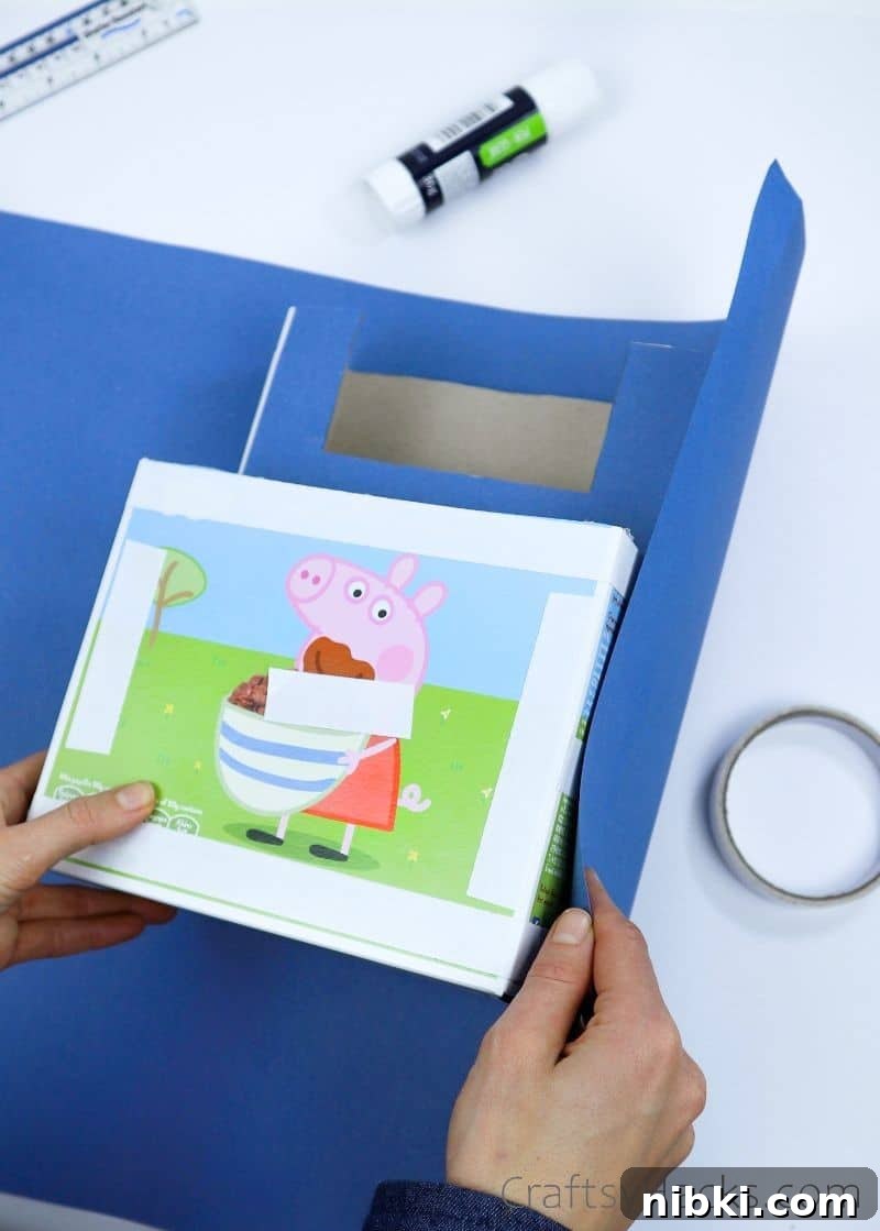 DIY Kitchen Cabinet Organizer to Maximize Storage 8 wrapping box in blue paper
