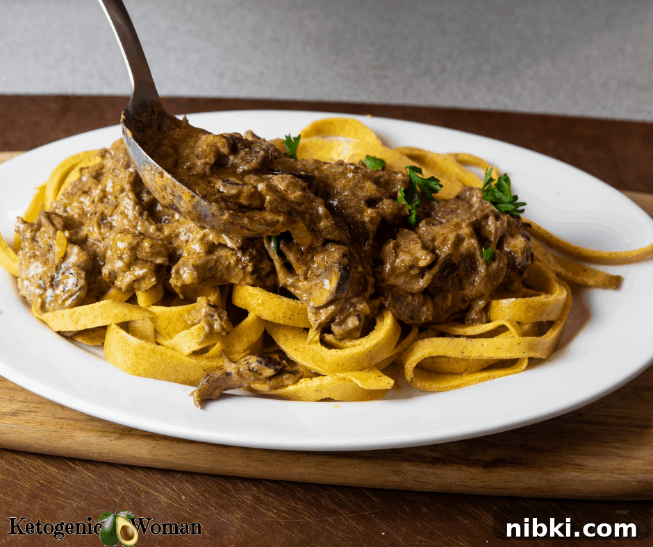Creamy Keto Beef Stroganoff with Mushrooms 3 Beef Stroganoff being served with large spoon