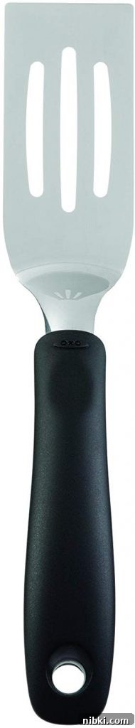 8 Small Kitchen Accessories That Save Space on Amazon 4 Small spatula lifting a brownie square from a pan
