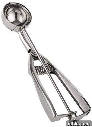 8 Small Kitchen Accessories That Save Space on Amazon 5 Cookie scoop releasing uniform dough portions