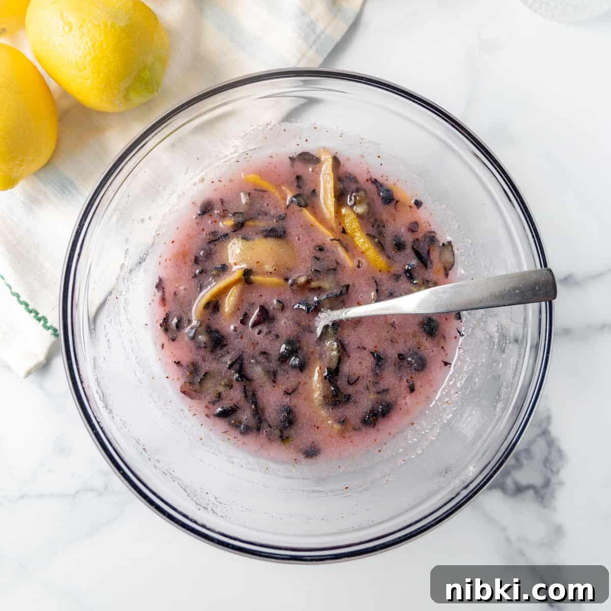 Homemade Blueberry Lemonade Recipe for a Refreshing Summer 4 mashed berries in a bowl