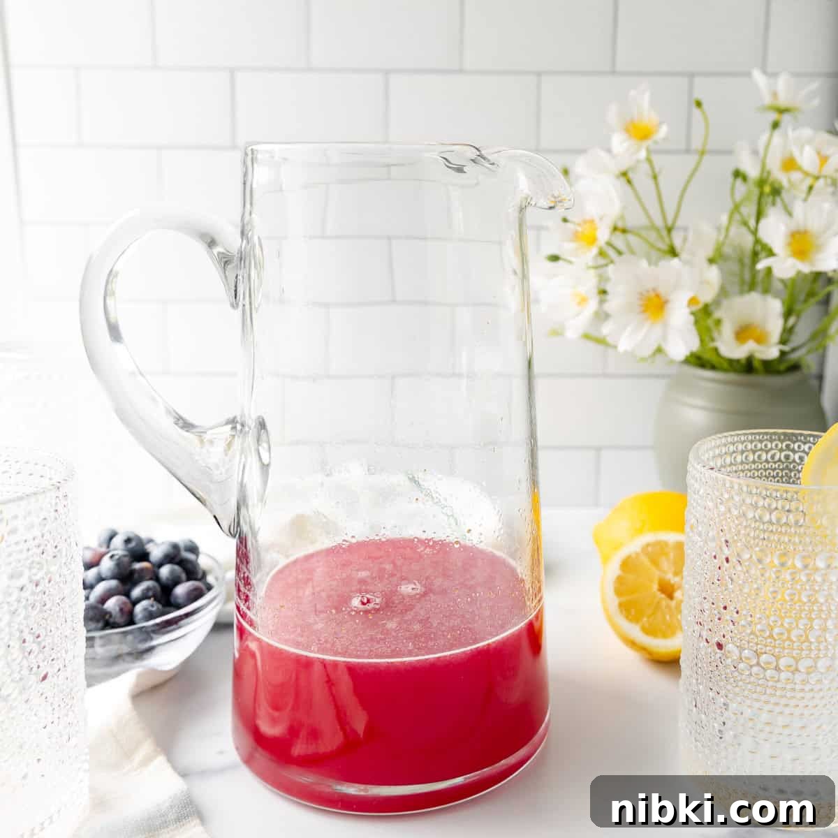 Homemade Blueberry Lemonade Recipe for a Refreshing Summer 6 strained blueberry syrup in a pitcher